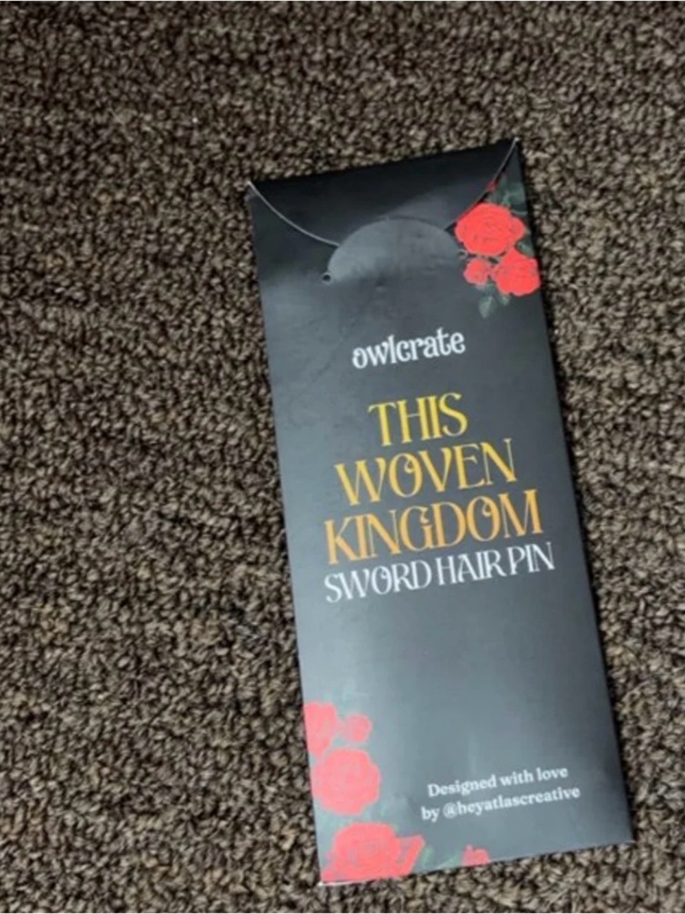 This Woven Kingdom Sword Hair Pin - Black with Red Accents